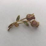 Alloy flower brooch with clear ruby and emeral crystal in gold plating